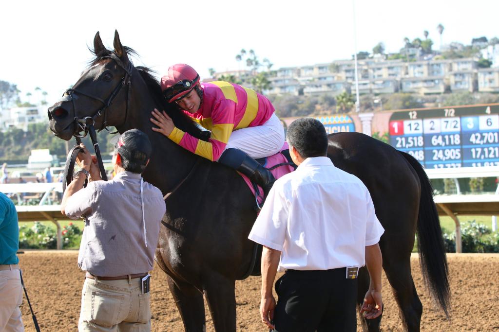 Avenge gets a hug from Flavien Prat. (Eclipse Sportswire)