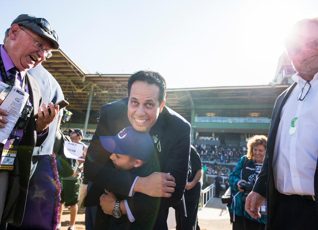 Phil D'Amato hugs his son after a Breeders' Cup win. (Eclipse Sportswire)