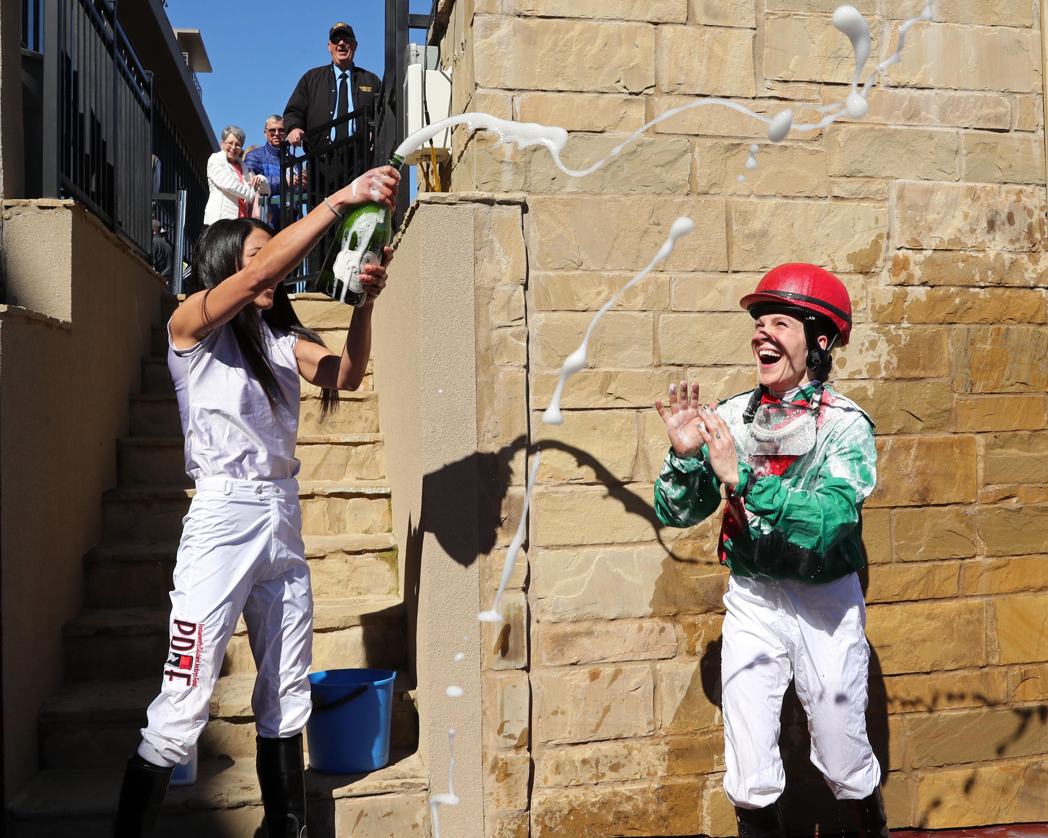Bailey is doused with champagne after her win.