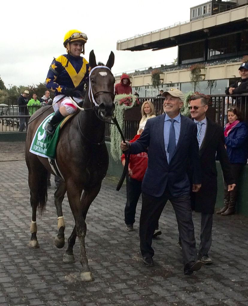 Jaime's dad leads Nickname into the winner's circle.