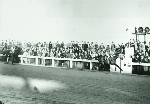 Seabiscuit soundly defeats War Admiral in a match race at Pimlico in November 1938.