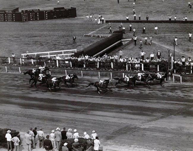 Assault hits the wire first in Brooklyn Handicap.