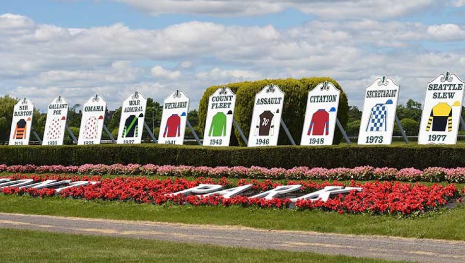 Triple Crown winners' silks grace the Belmont Park infield.