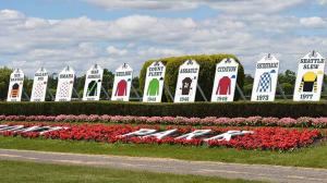 Triple Crown winners' silks grace the Belmont Park infield.