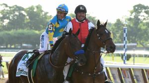NYRA outrider Miguel Gutierrez escorted both American Pharoah and Justify to the winner's circle after their Triple Crown victories.