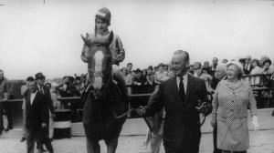 John Hay Whitney leads Stage Door Johnny into the 1968 Belmont Stakes winner's circle.