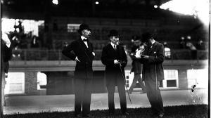 James R. Keene (middle) with son Foxhall Keene (left) and an unidentified man.
